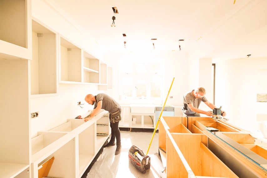 two men fitting a new kitchen