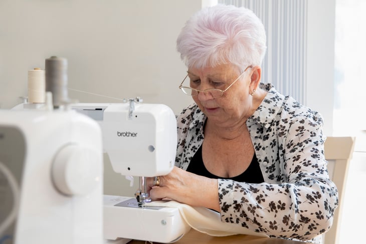 Derby Court resident Marie Finigan sewing