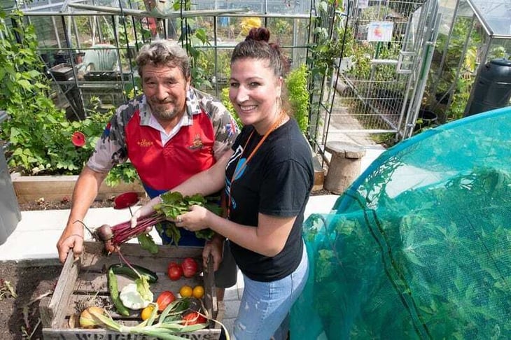 Two residents gardening